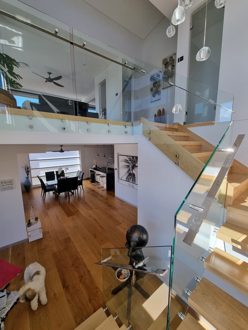 A View Of A Living Room From The Top Of A Staircase — South Coast Glass In South Nowra, NSW