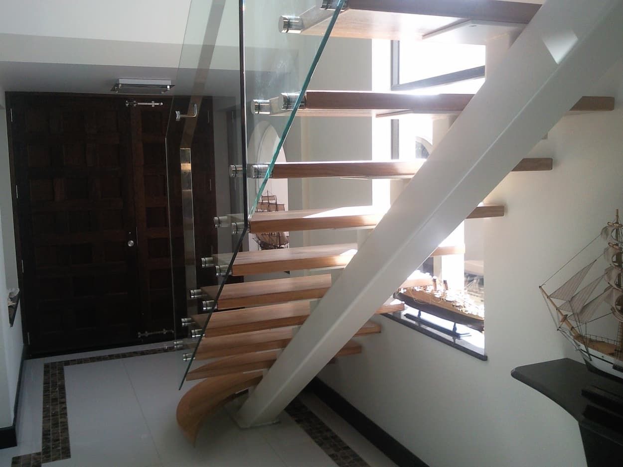 A Staircase With Wooden Steps And A Glass Railing — South Coast Glass In South Nowra, NSW