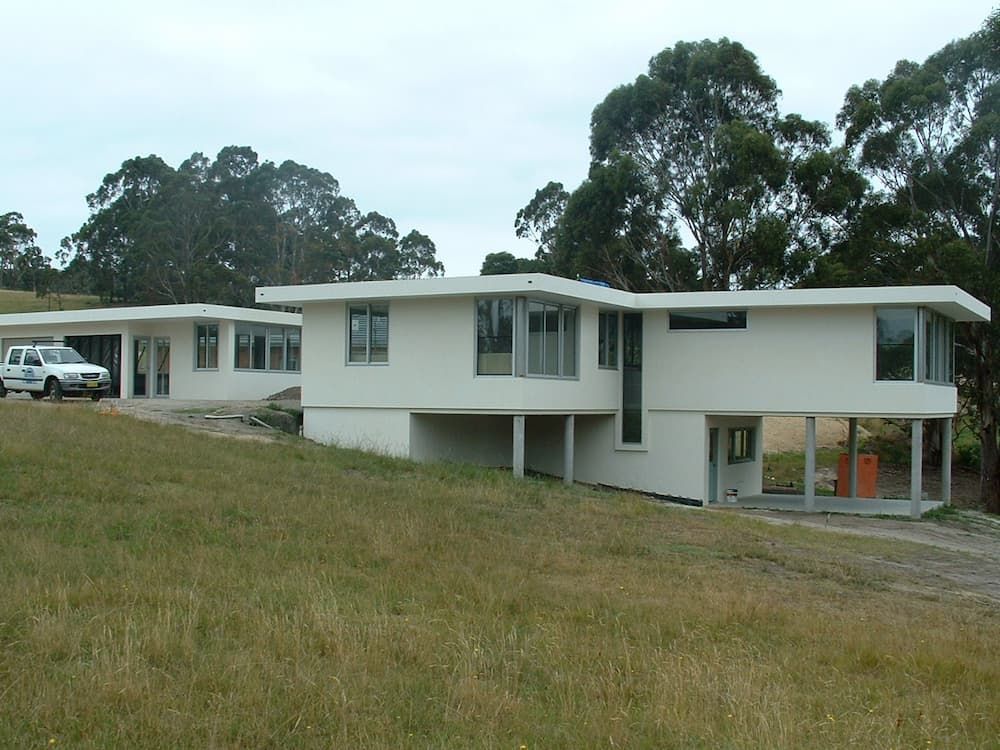 A White Truck Is Parked In Front Of A White House — South Coast Glass In South Nowra, NSW