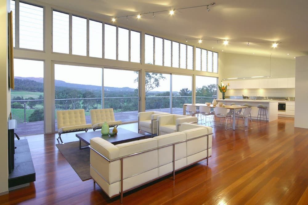 A Living Room With A White Couch And Chairs — South Coast Glass In South Nowra, NSW