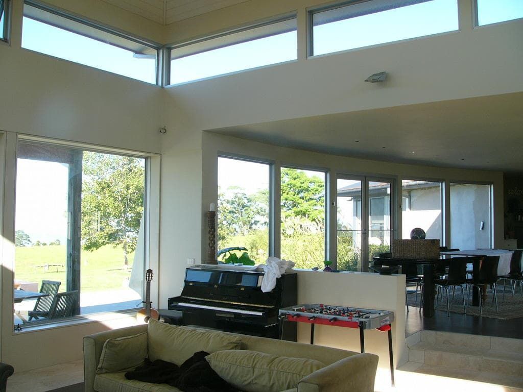 A Living Room With A Couch And A Piano — South Coast Glass In South Nowra, NSW