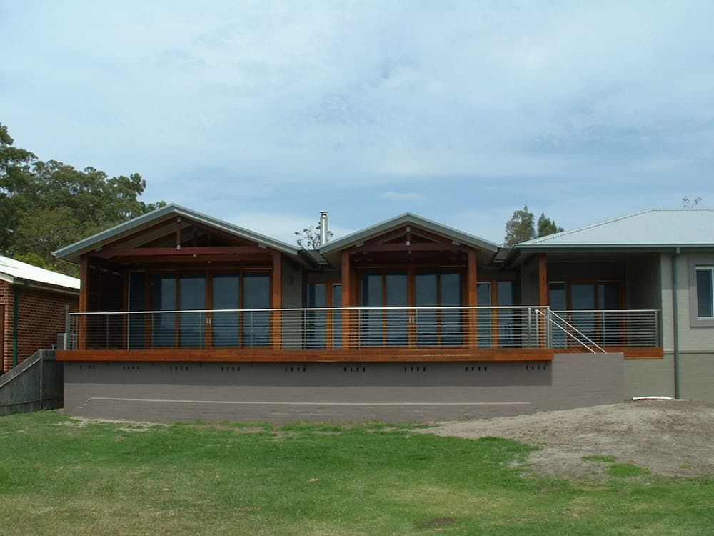 A House With A Lot Of Windows And A Balcony — South Coast Glass In South Nowra, NSW