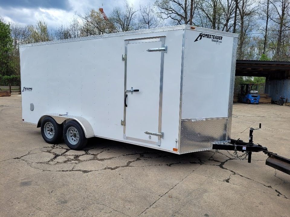 White enclosed cargo trailer parked outside. | Gainesville Garage & Trailer Sales
