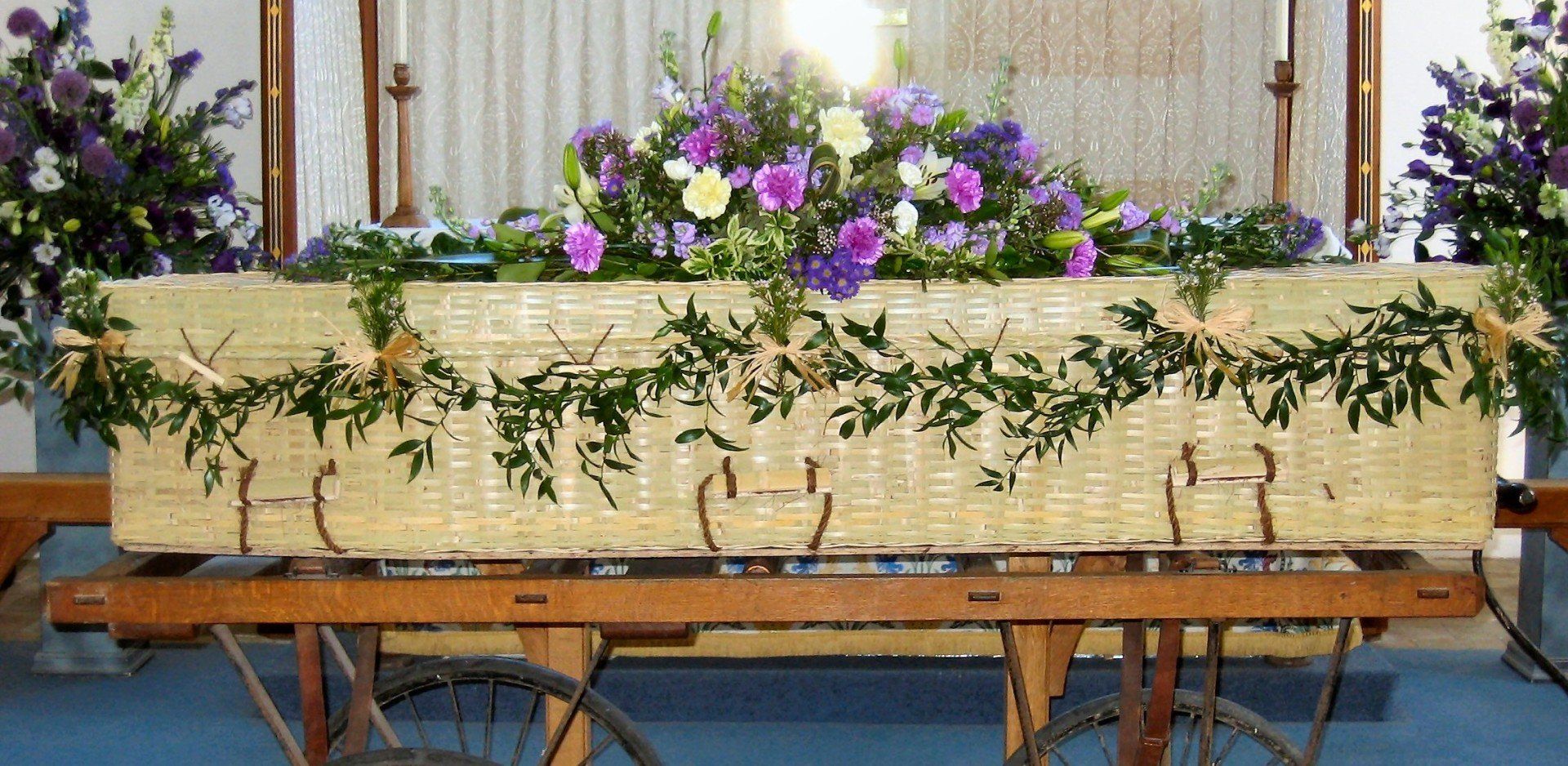 6.  Garland of Soft Ruscus with bunches or white Waxflowers and Raffia bows
