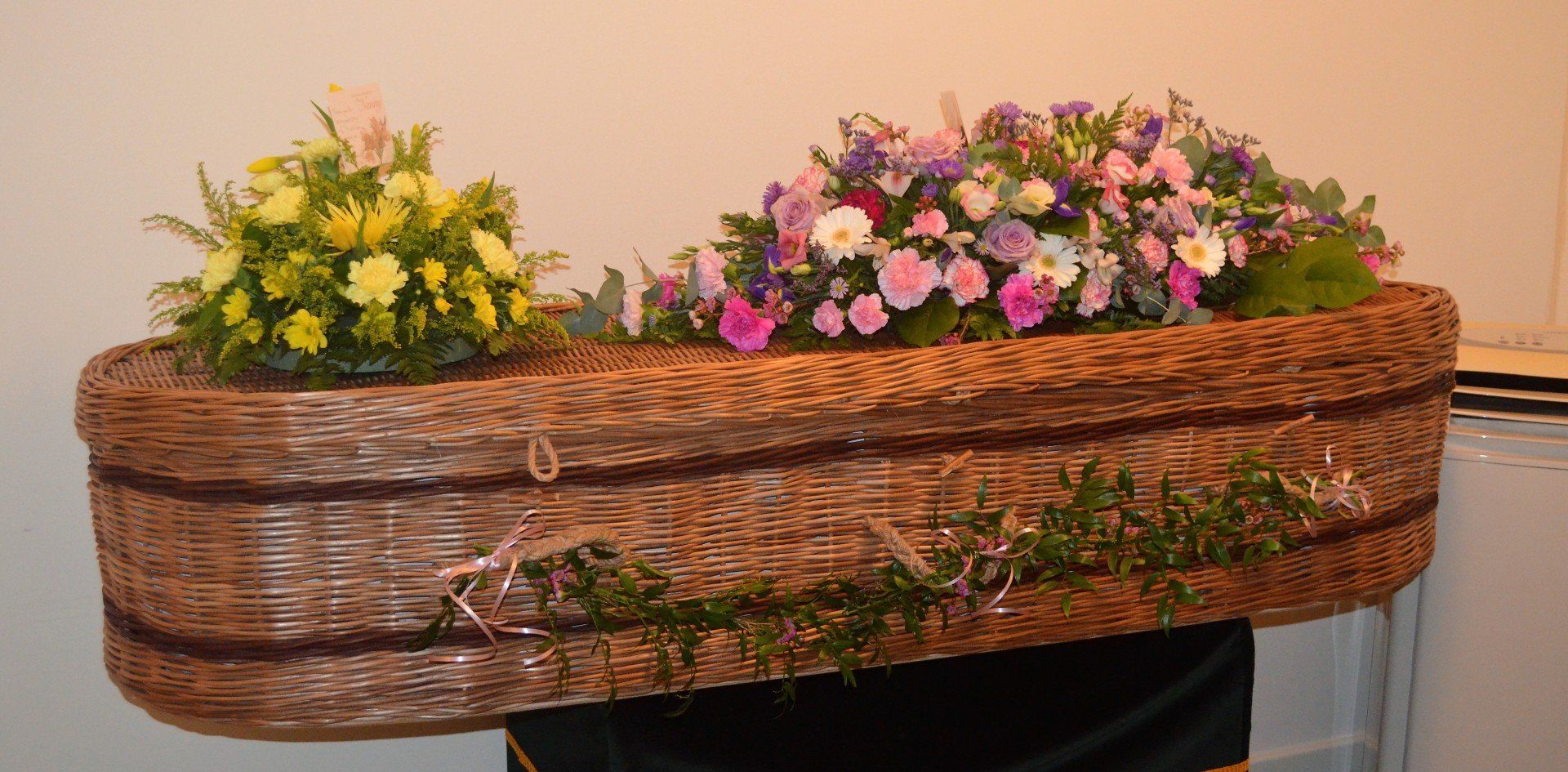 7.  Half Garland of Soft Ruscus decorated with pink Waxflowers and ribbons