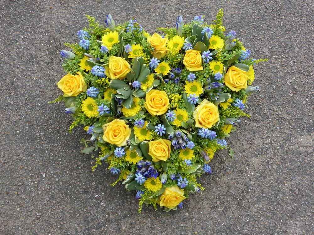 20. Beautiful yellow and blue Heart with yellow Roses and blue Muscari