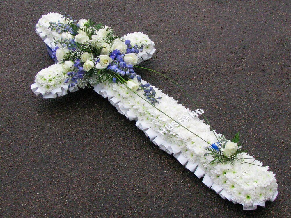 8. 5ft Cross with white ribbon edge, white Roses and blue Delphiniums with Aluminuim letters
