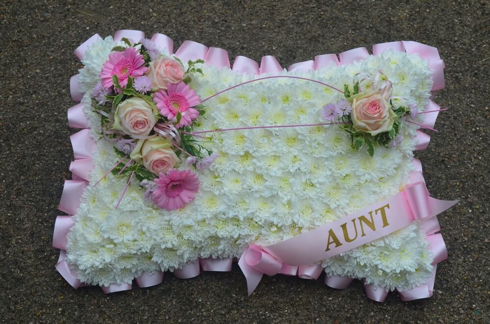 4. 18” White Pillow with pink ribbon edge and sash, posies of Germini and Roses