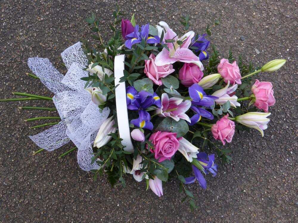 4.  Trug Basket of pink Roses and Lily’s with blue Iris