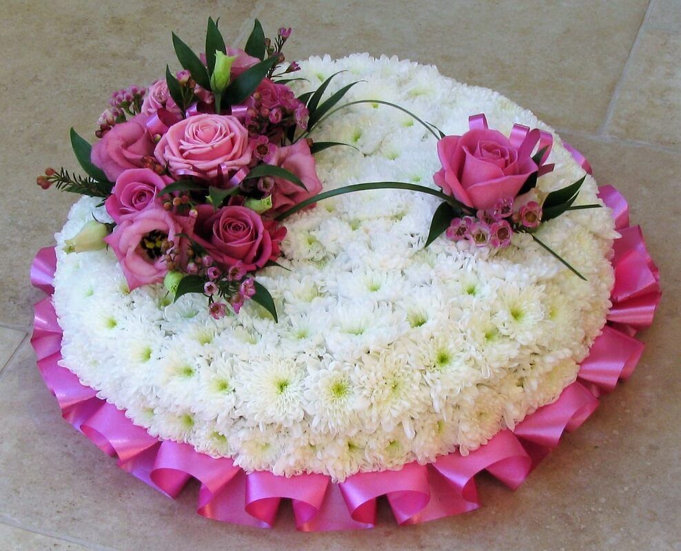 25.  12” posy with pink ribbon edge, white Chrysanthemums and pink posy’s
