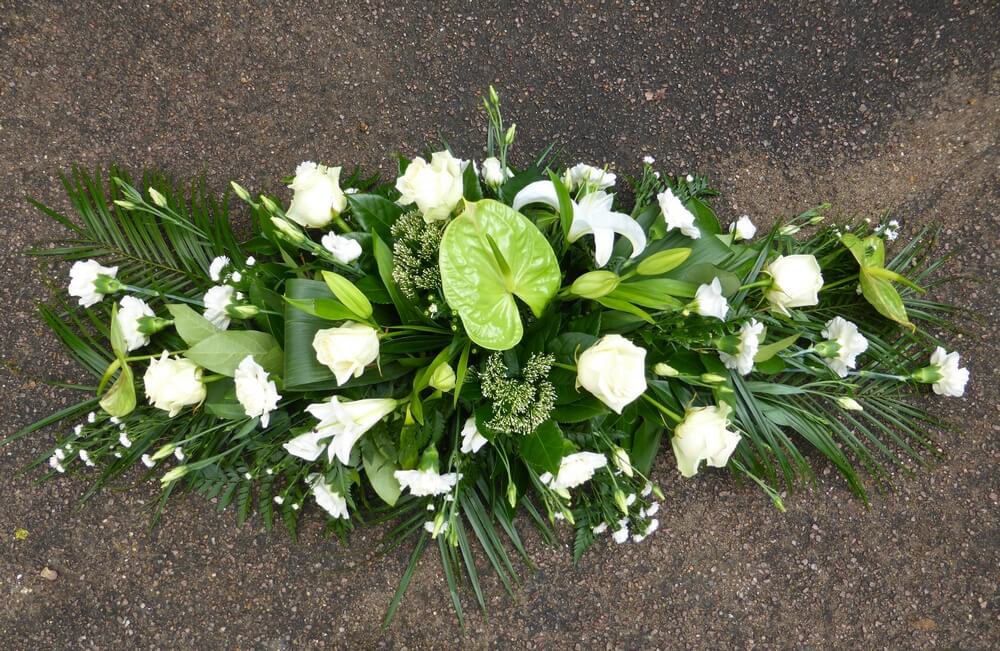 36. White and green spray of Anthuriums, Roses, Lily’s, Carnations and Asters