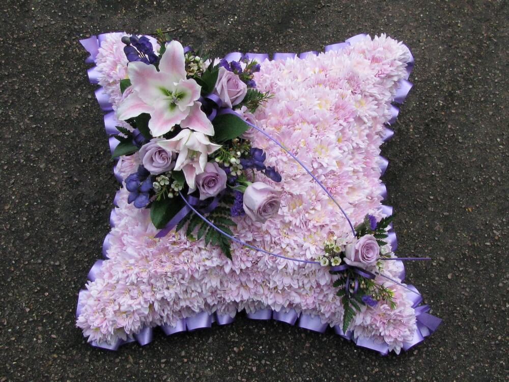 16. 15” pink Cushion with lilac ribbon edge, posies of lilac Roses and pink Lily’s