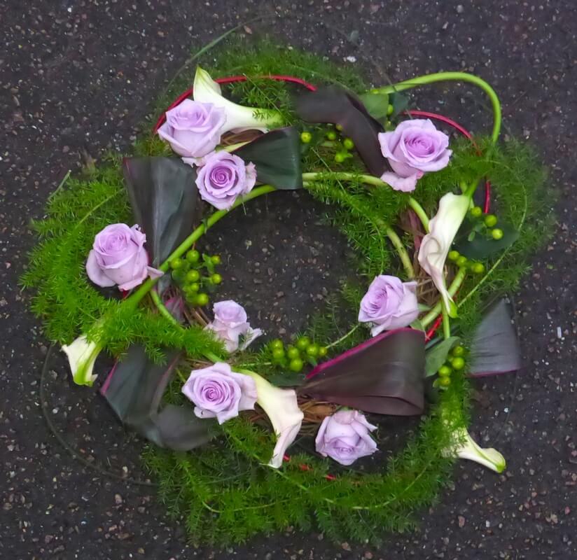 37.  12” Natural Willow wreath with purple Callas and Roses