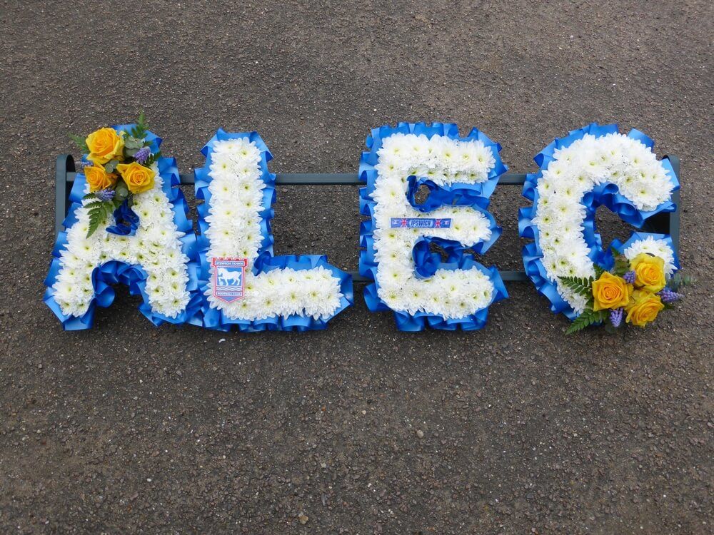 17. White letters with yellow Roses and blue Muscari posies, Ipswich Town logos