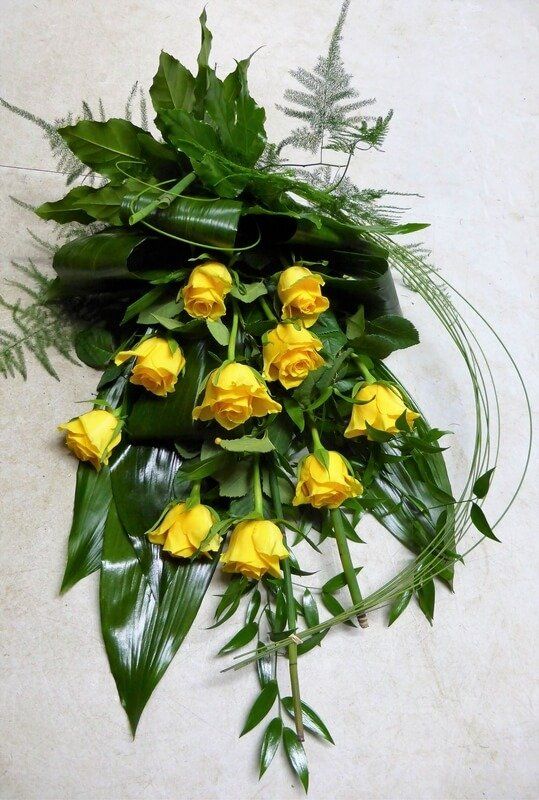 28. Modern sheaf with glossy foliage and yellow Roses