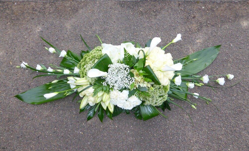 35. Modern white spray with Callas, Roses, Lily’s, Trachelium, Lisianthus, Carnations, Gypsophila and foliage