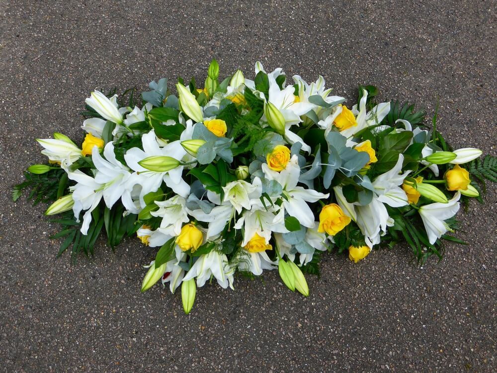 34. Spray of white Lily’s and yellow Roses