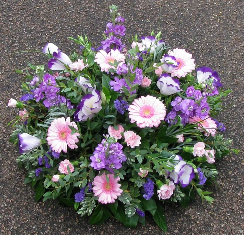 20.  12” Posy of purple Stocks, two tone Lisianthus and pink Germini