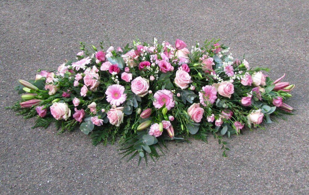 29. Feminine pink spray of Lily’s, Roses, Dianthus, Lisianthus and Germinis