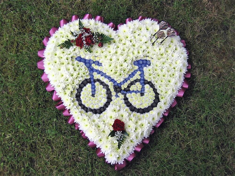 4.  White Heart with Bicycle, three Darts and posies of red Rosebuds