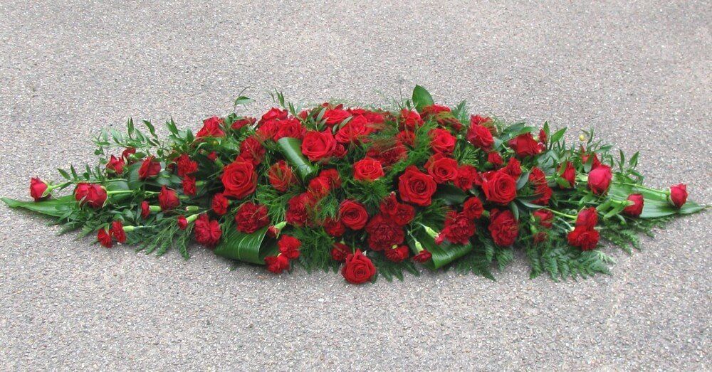 25. Classic all red coffin spray with Roses, Carnations and Dianthus
