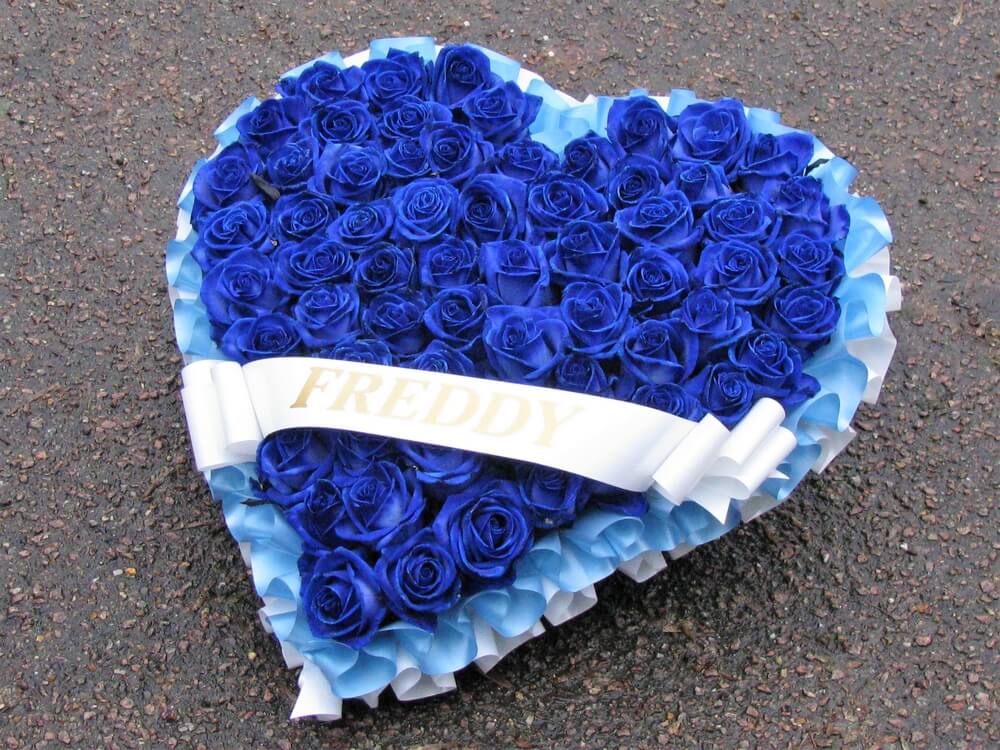 1.  Blue Rose heart with blue and white ribbon edging and ribbon sash