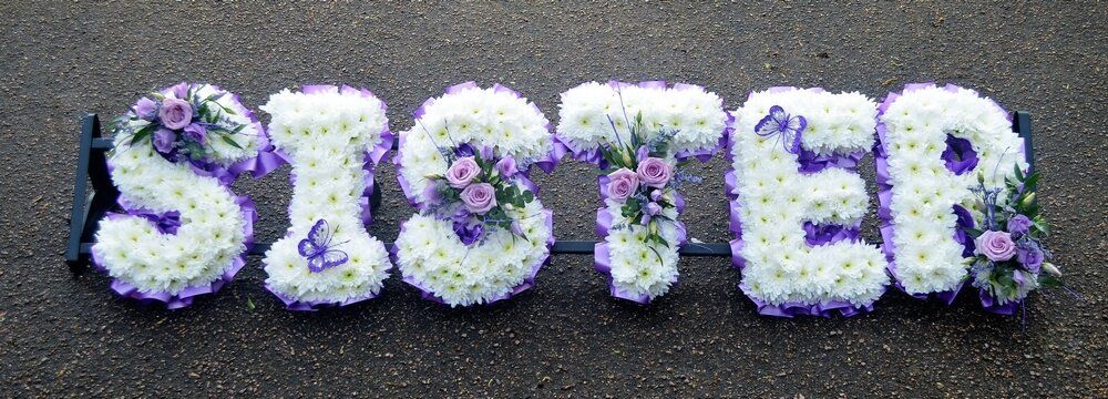 35. SISTER with white letters, purple ribbon edge, lilac Roses and Lisianthus posies and purple Butterflies