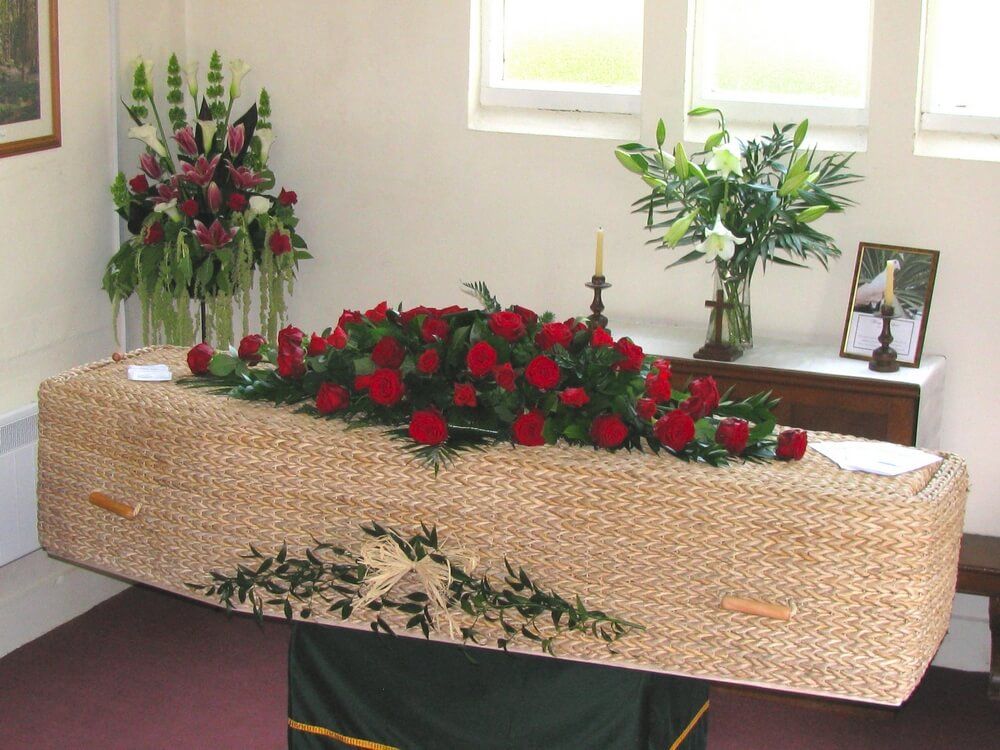 51. Red Rose coffin spray with small Garland and Raffia