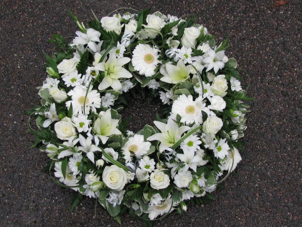 9.   14” white Wreath of Roses, Lilys, Dianthus and Germini