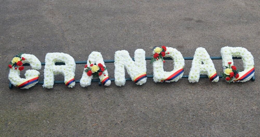 10. White set letters with Royal Norfolk Regiment colours on each letter