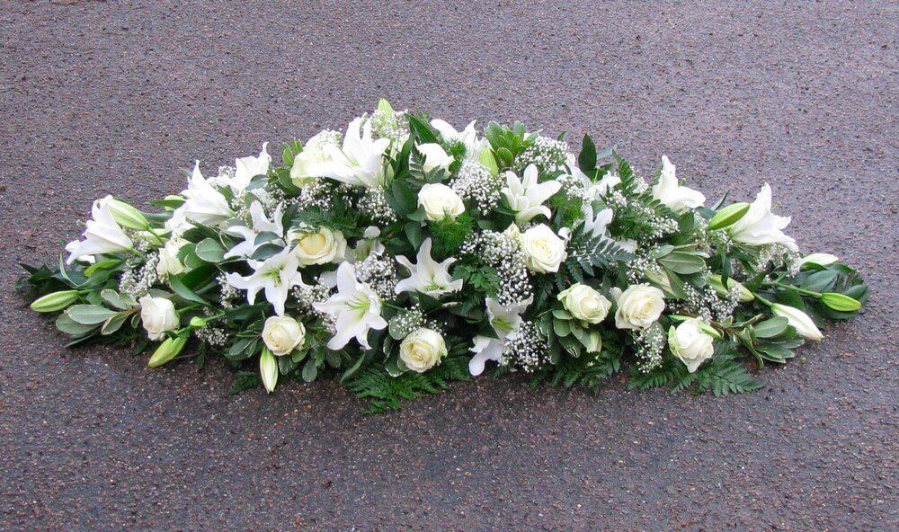 23. Traditional white spray with Lily’s, Roses and Gypsophila