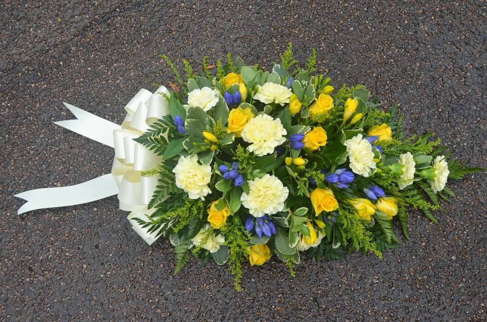 8. Spray with yellow Roses, Freesia, Golden Rod, Carnations and Blue Gentianas