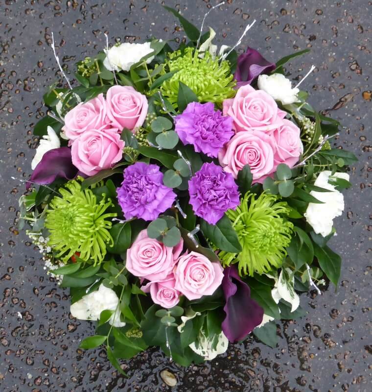 35.  12” posy with pink Roses, green Chrysanthemums and purple Carnations