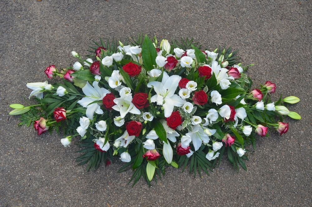 14. Spray of white Lily’s and Lisianthus and Ruby Red Roses