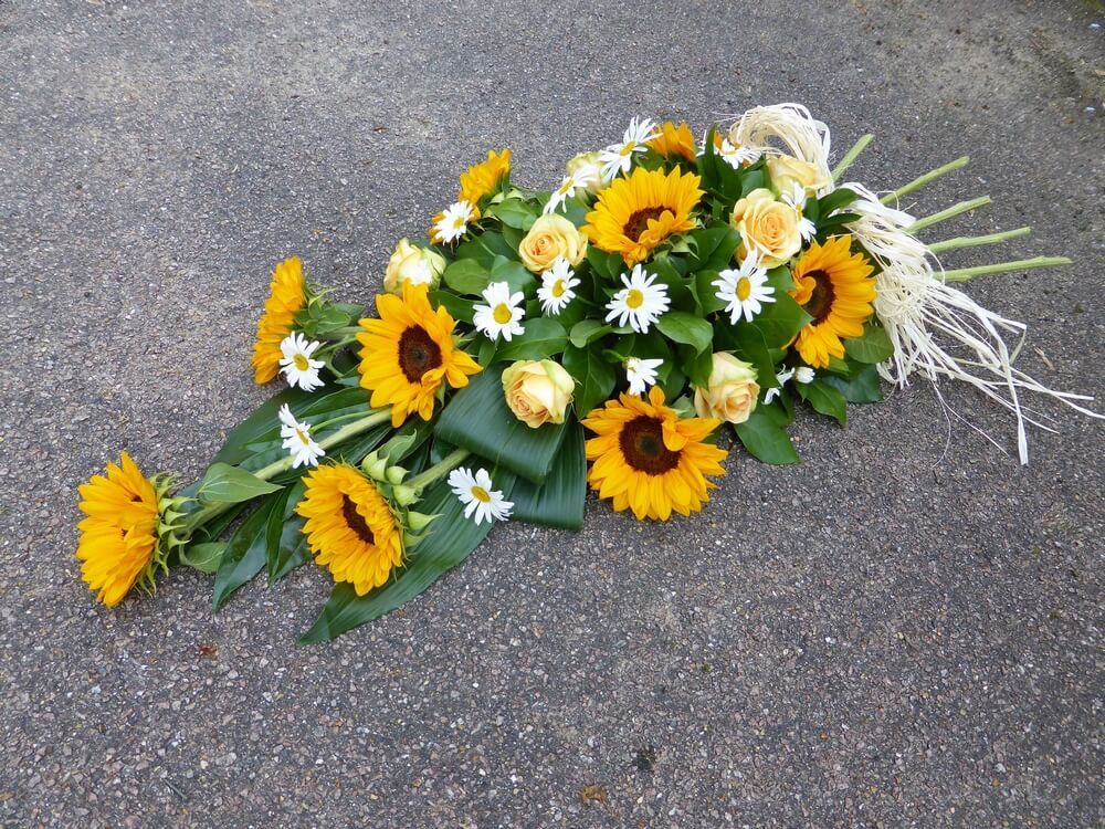 1.  Spray with Raffia and stalk end, Sunflowers, Daisies and Caramel Roses