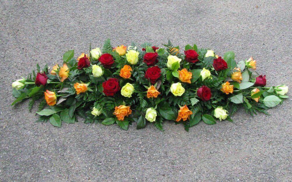 7. Spray of Lemon, Orange and Red Roses