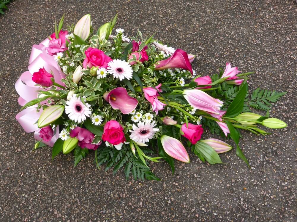 39. Beautiful spray of deep pink Roses, Callas, Oriental Lily’s, Germini, Bridal Glads and Lisianthus