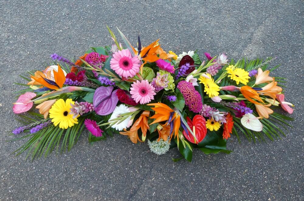 4.   Large Tropical Spray with Strelitzia, Liatris, Baby Pineapples, Anthuriums, Lily’s, Gladiolus, Gerberas and Celosia