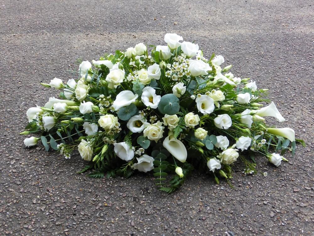 3.   Small white Rose, Calla and Lisianthus spray suitable for an Infant