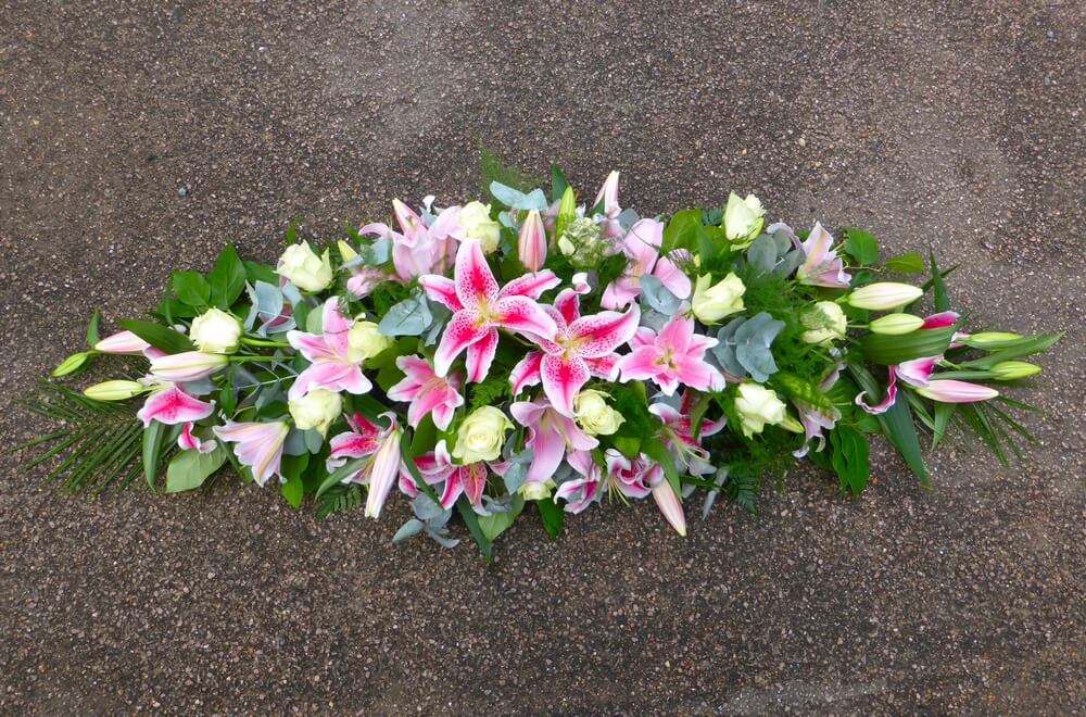 48. Beautiful spray of pink Lily’s with white Roses