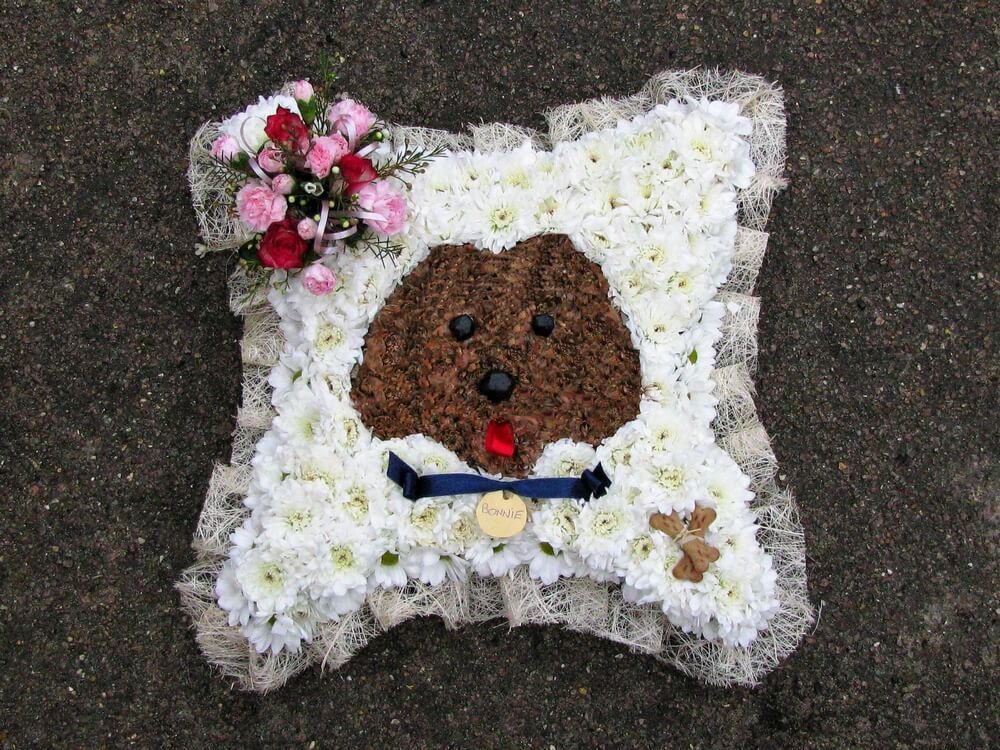 13. 12” Cushion with Sisal edge, small corner posy ,custom made Dogs Head to the centre with name and gravy bones