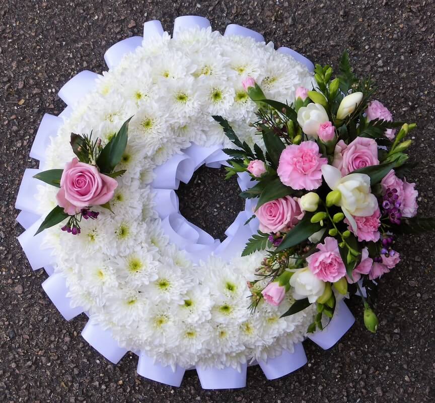32.  12” Pink and white wreath with ribbon edge, Chrysanthemums, Roses and Freesias