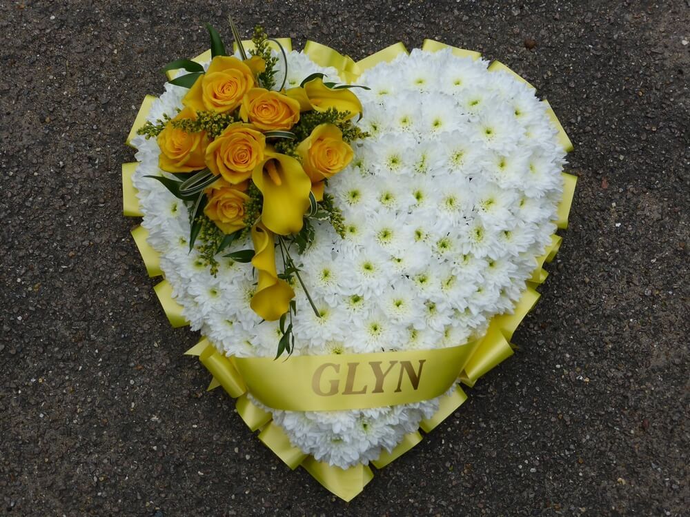 23. White Heart with yellow ribbon edge and sash, yellow Roses and Calla Lily posy