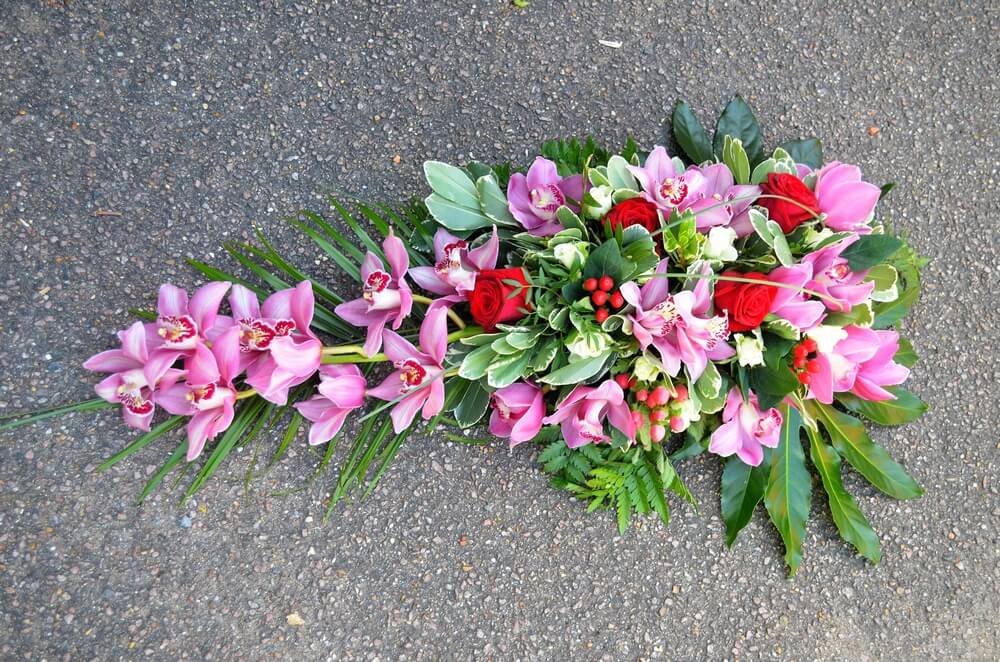 42. Cymbidium Orchid spray with Roses and Berries