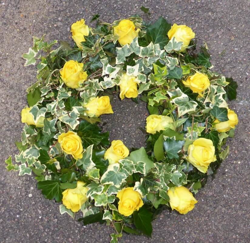 31.  12” Ivy wreath with yellow Roses