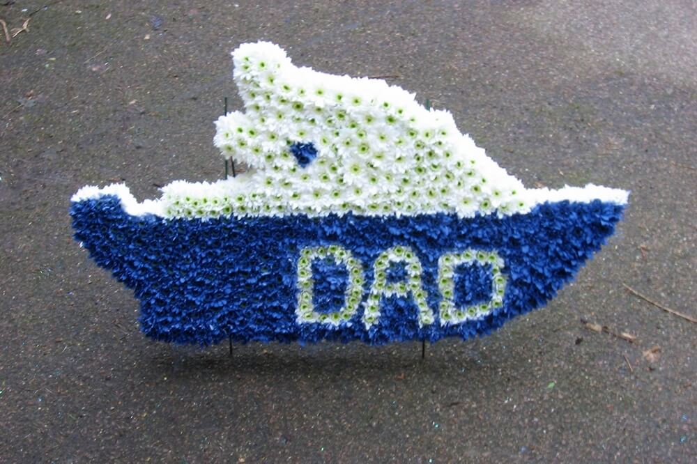 82.  Very large blue and white Boat on its own stand