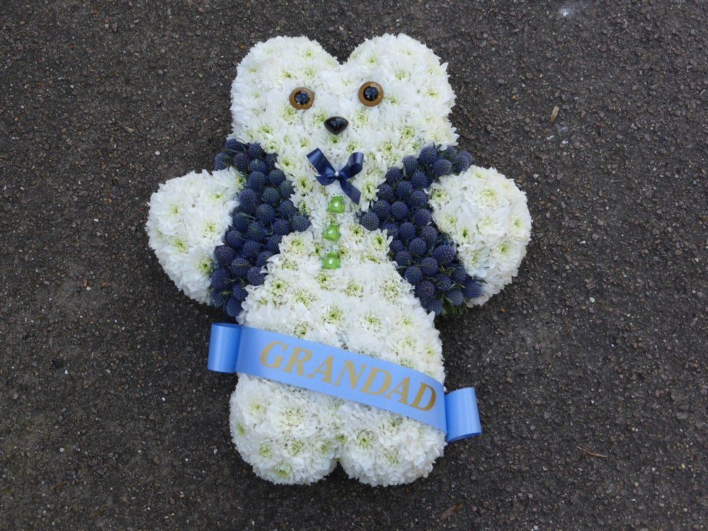 85. Boy Teddy with ribbon sash