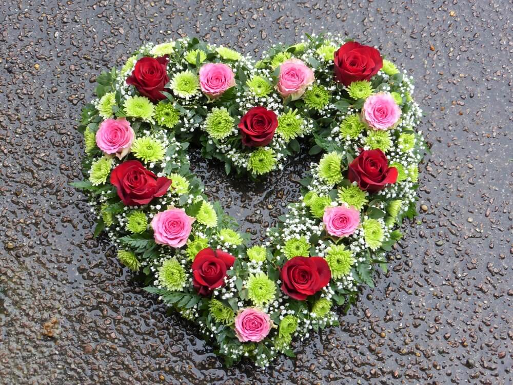 22. Hollow Heart with pink and red Roses, Gypsophila and green Chrysanthemums
