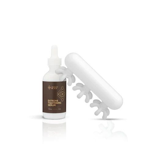 A bottle of serum next to a white object with nails on it.