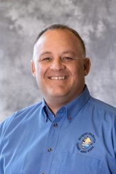 Man in blue shirt with 